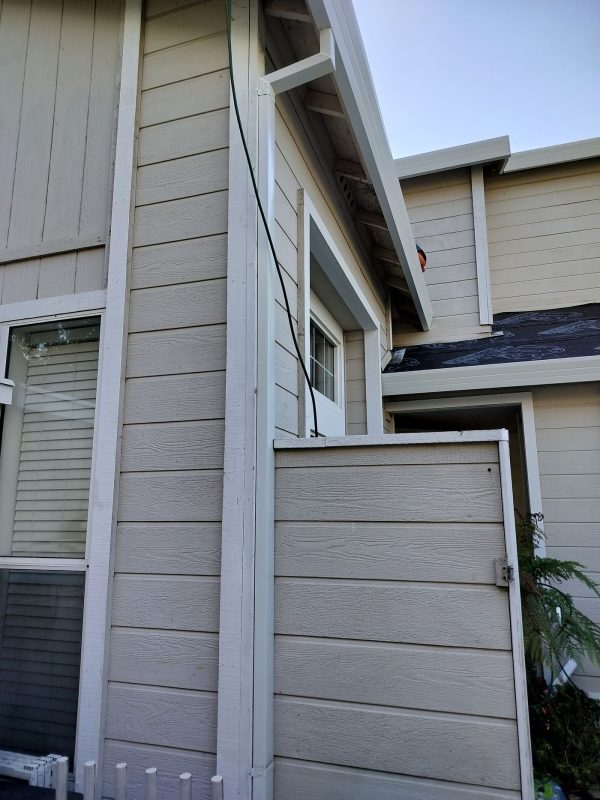 White Downspout Installation